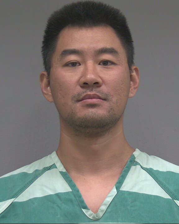 Booking photo of Peng Shi