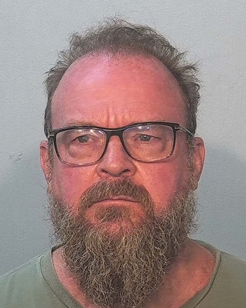 Booking photo of Jonathan Miller