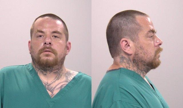 Booking photo of Adam Hector