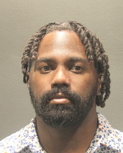 Booking photo of Travis Highland