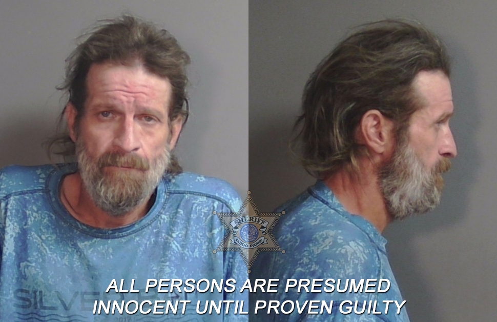 Booking photo of Christopher Burton Reed