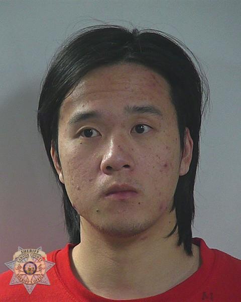 Booking photo of Xiang Huang
