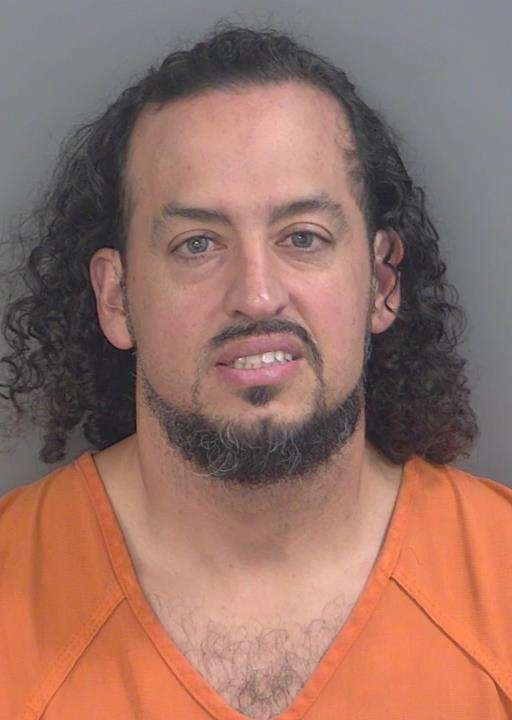 Booking photo of Alex Rivera