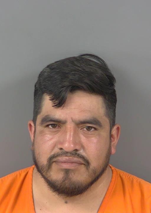 Booking photo of Miguel Cardona