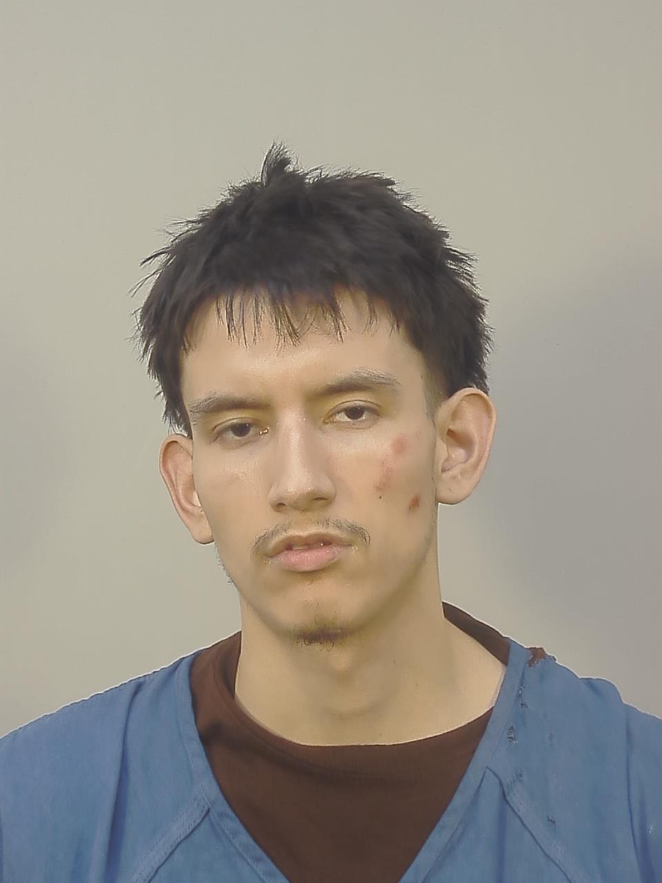 Booking photo of Angel Christian Reyes Gaytan