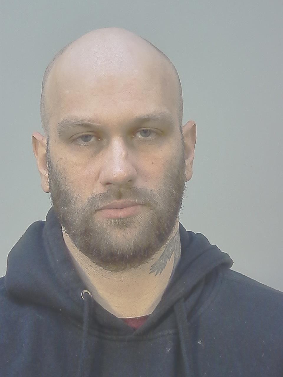 Booking photo of Travis Brenten Hoffer