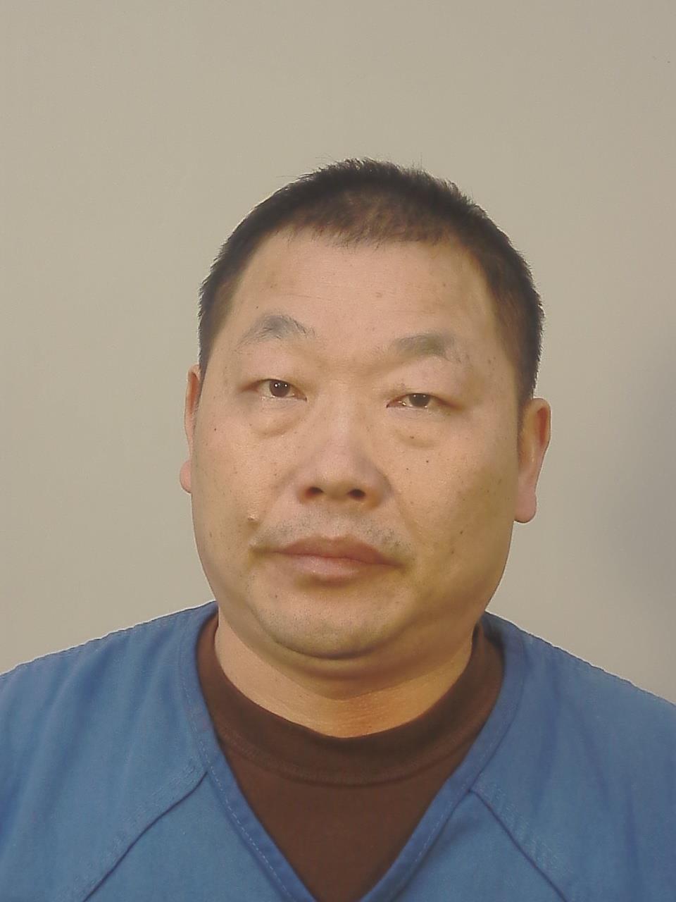 Booking photo of Guangguo Li