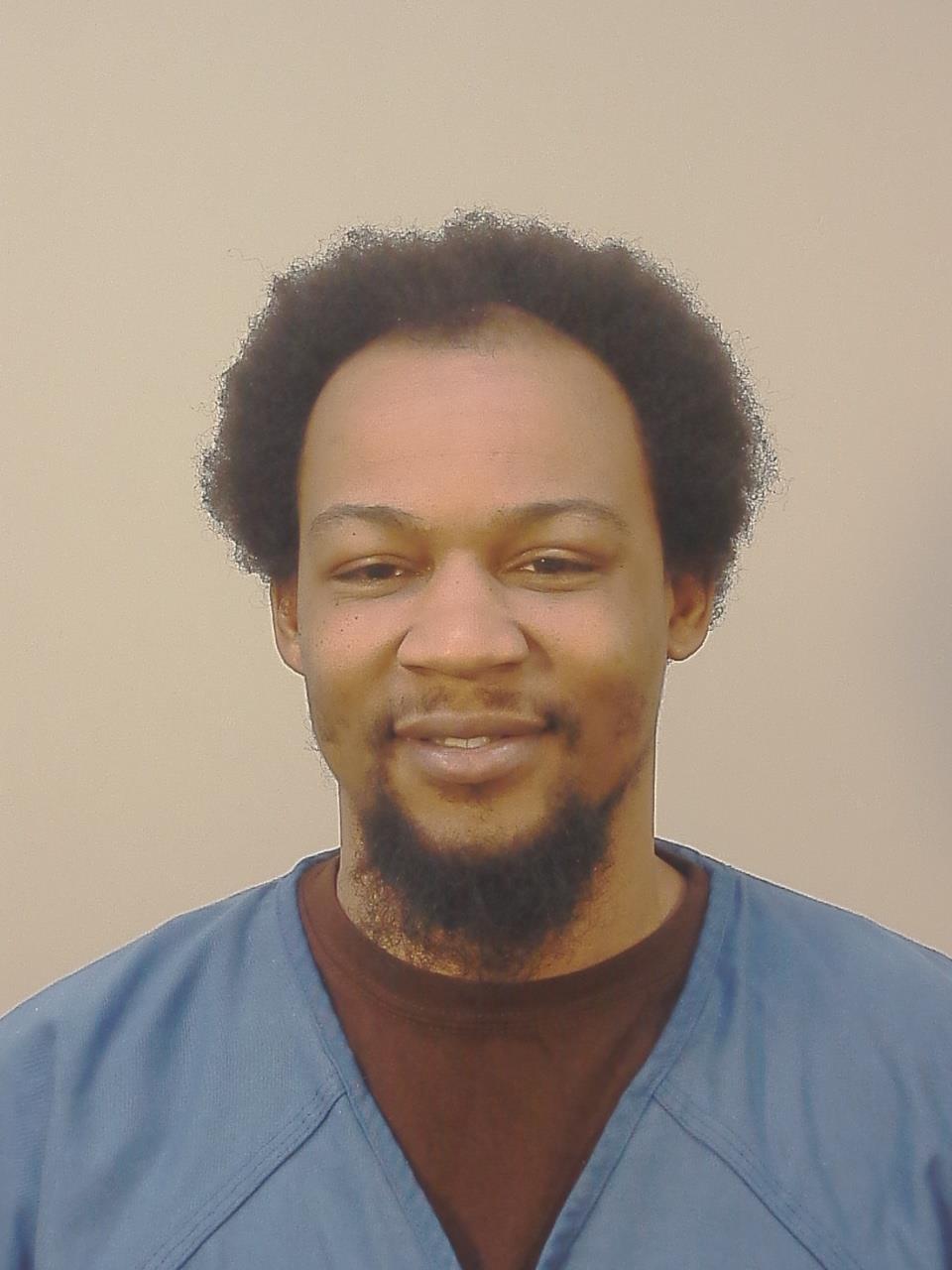 Booking photo of Justin Denzel Reasby