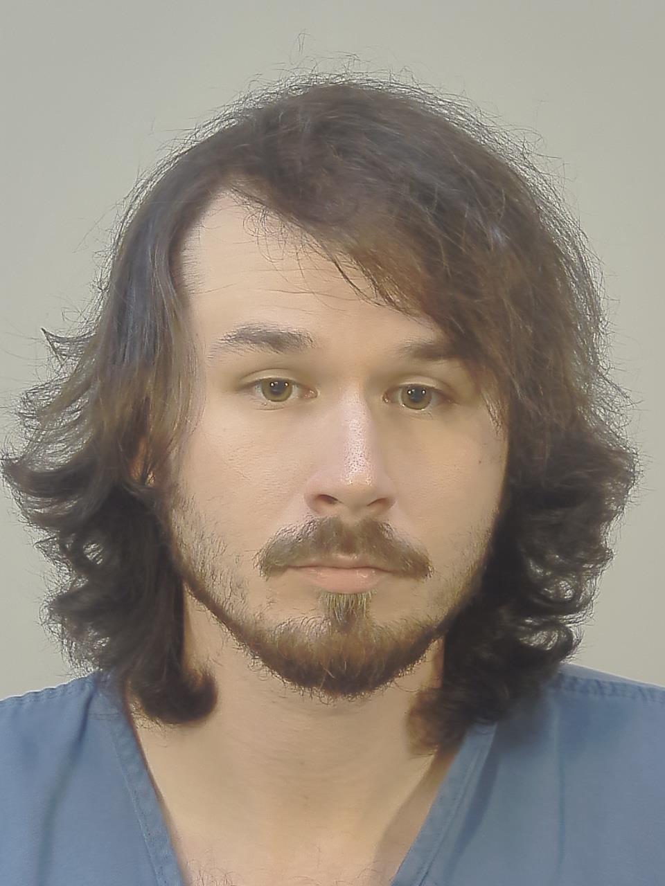 Booking photo of Justin Aaron Warren