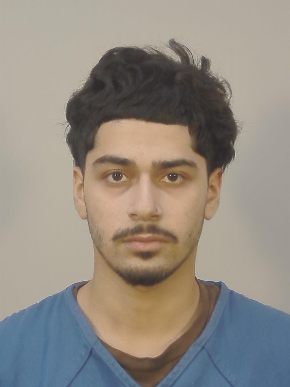 Booking photo of Angel E Castro