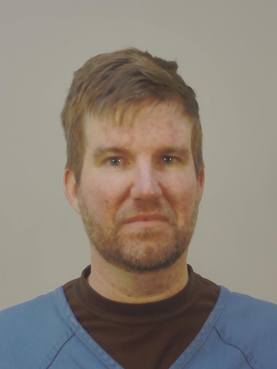 Booking photo of Ryan Michael Burbach