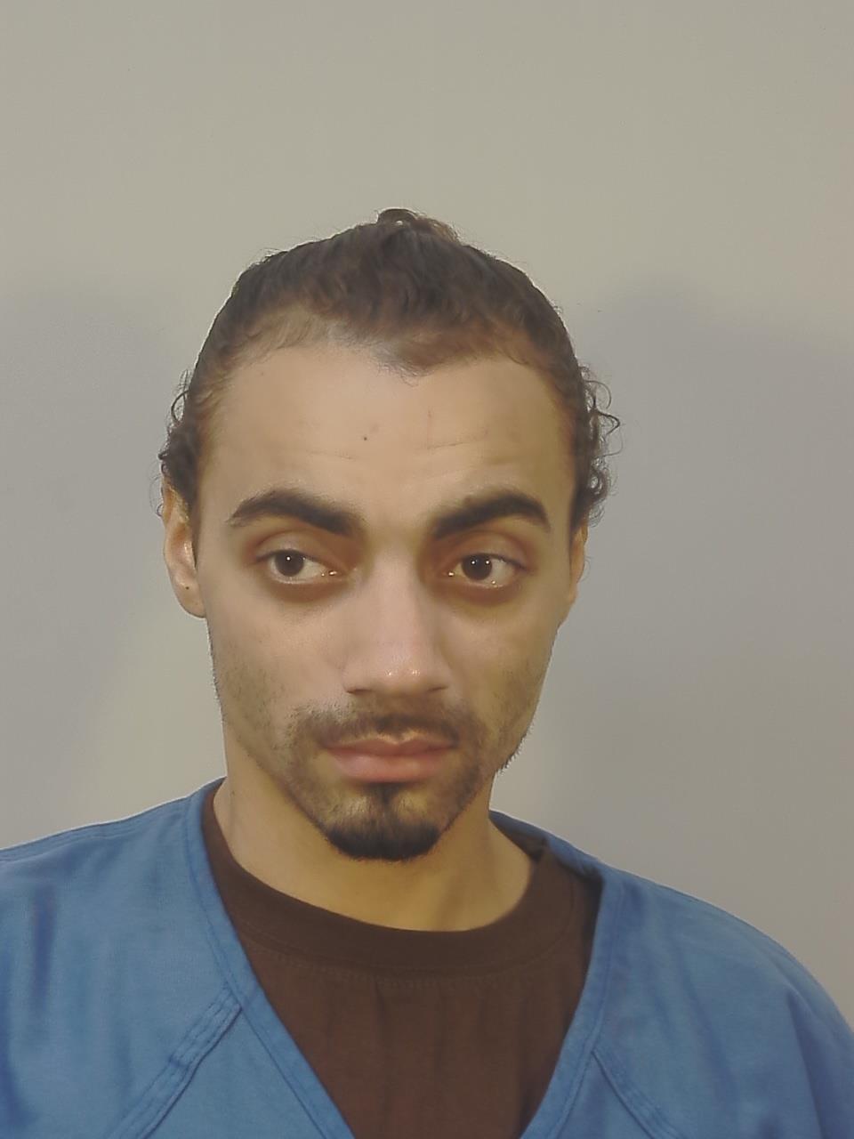 Booking photo of Malik Dejon Moreno