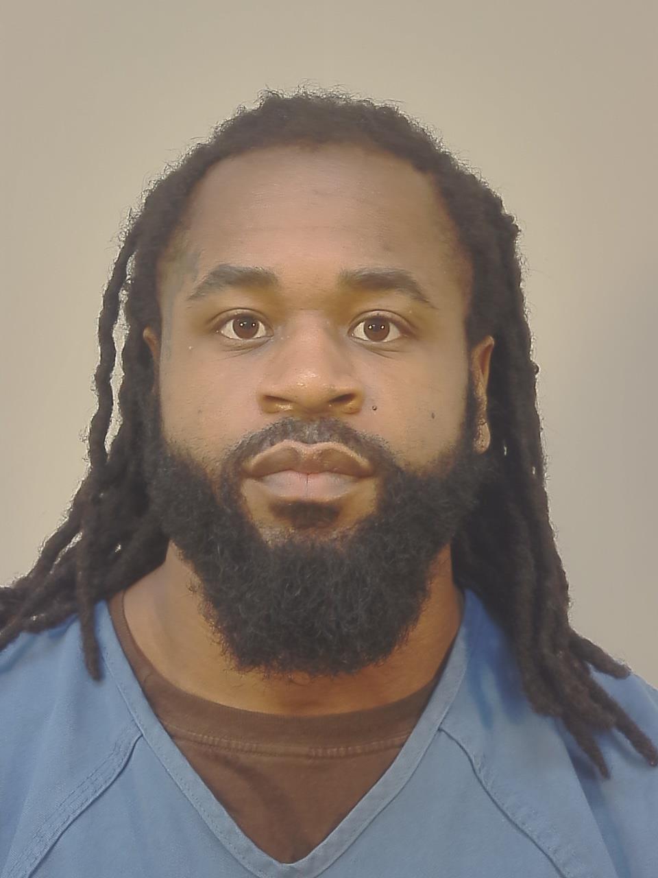 Booking photo of Aaron Jarzine Riles