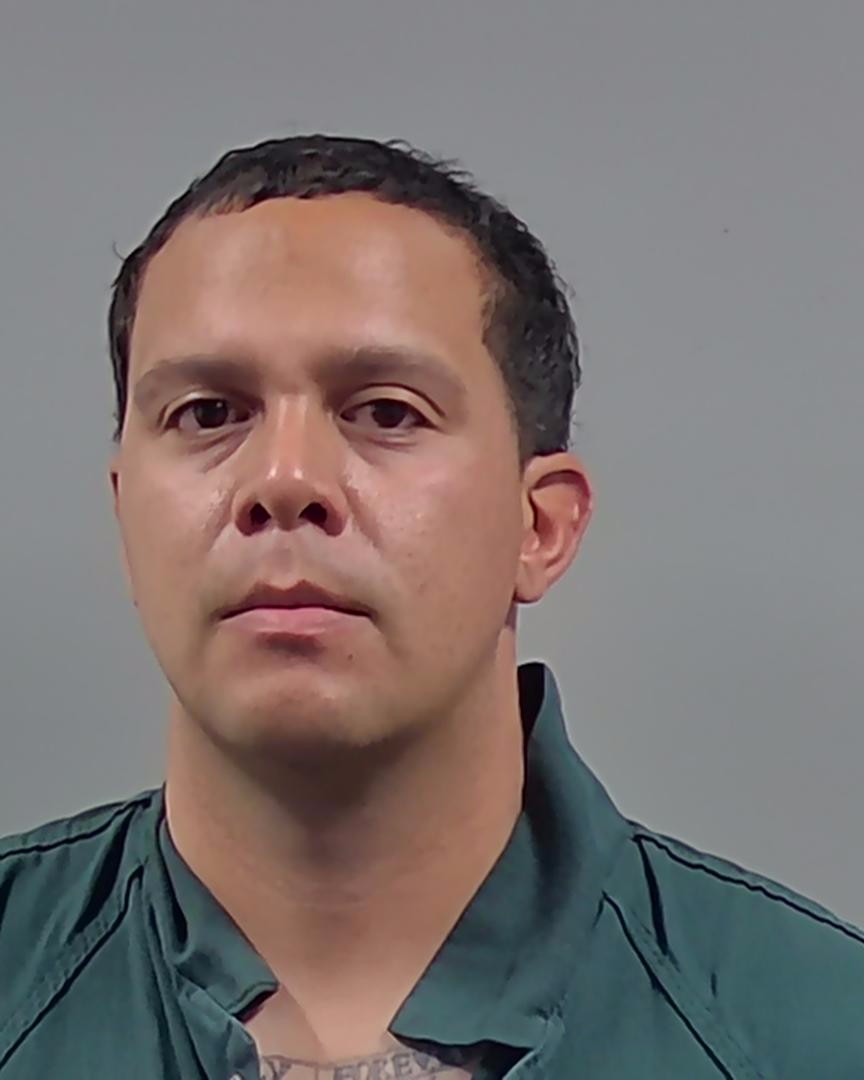 Booking photo of Eliezer Baez