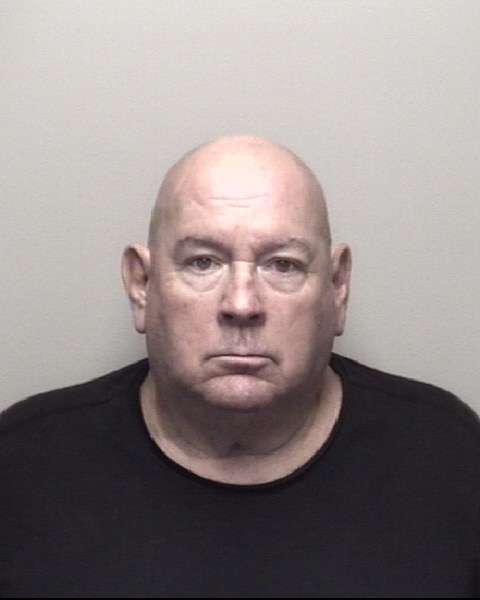 Booking photo of Samuel Adams