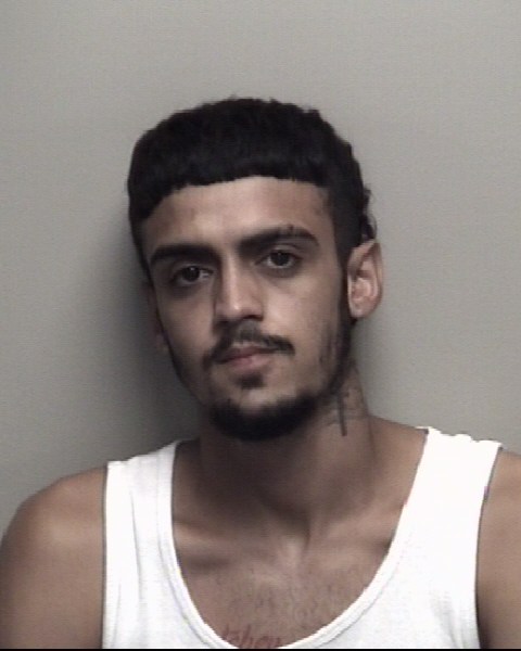 Booking photo of Alexis Santos