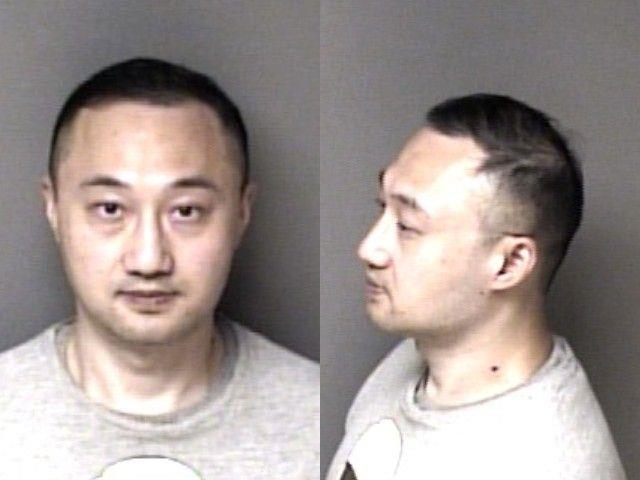 Booking photo of Zhou Yu