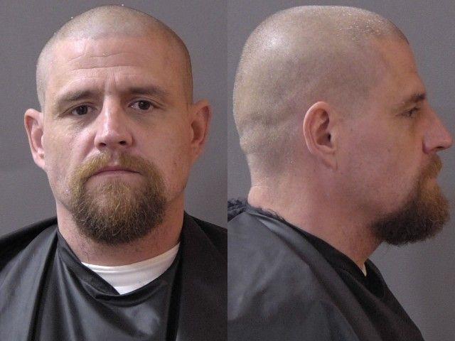 Booking photo of Adam Robertson