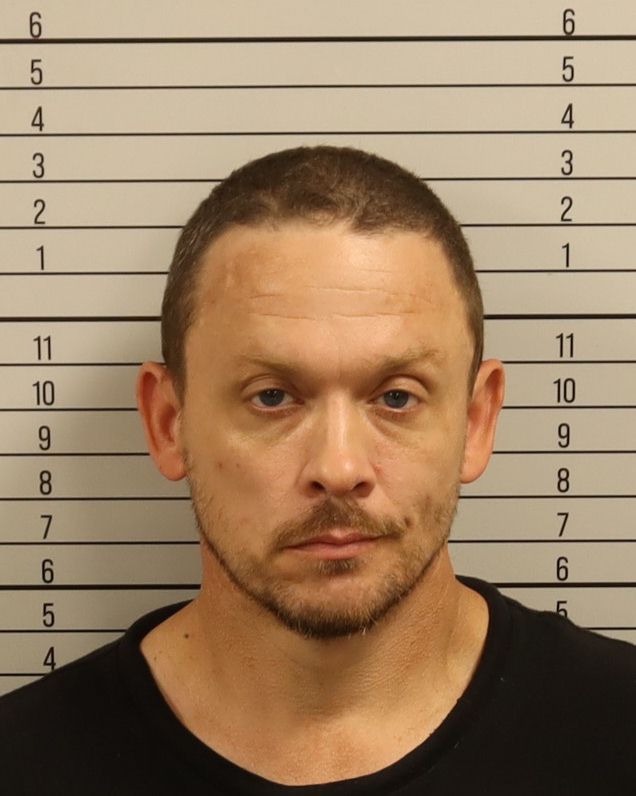 Booking photo of Justin Craig Neergaard