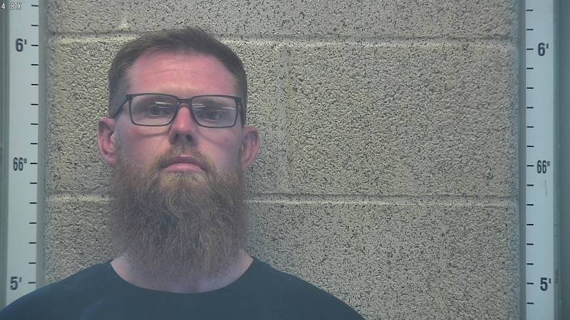 Booking photo of Travis Buckreis