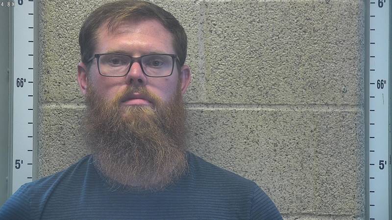 Booking photo of Travis Buckreis