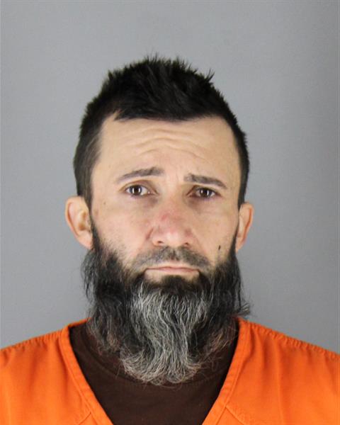 Booking photo of Jason Brenna