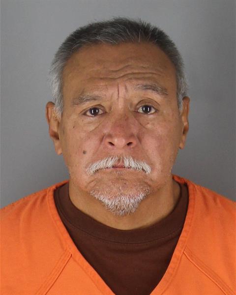 Booking photo of Carlos De La Rosa
