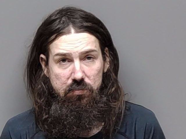 Booking photo of Justin Michael Mills