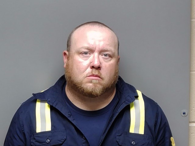 Booking photo of Justin Matthew Burton