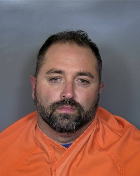 Booking photo of Johnny Clark