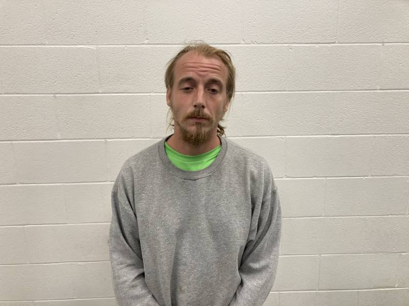 Booking photo of John Carrara