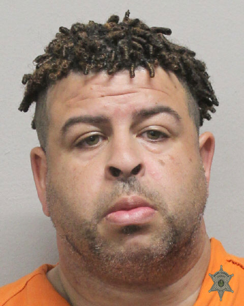 Booking photo of Dominick Derousselle