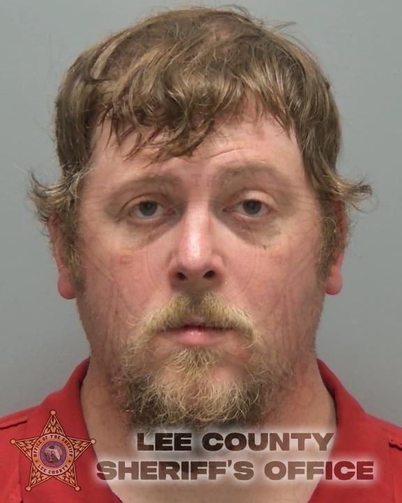 Adam Warner booking photo