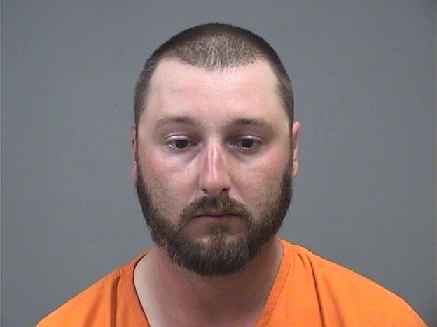 Booking photo of Travis Holcomb