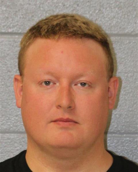 Booking photo of Derek Kramer