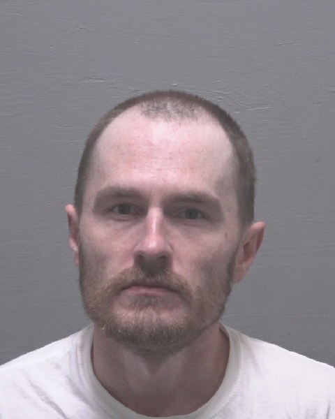 Booking photo of Justin Carroll
