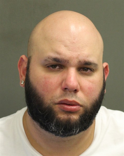 Booking photo of Carlos Delatorreevora