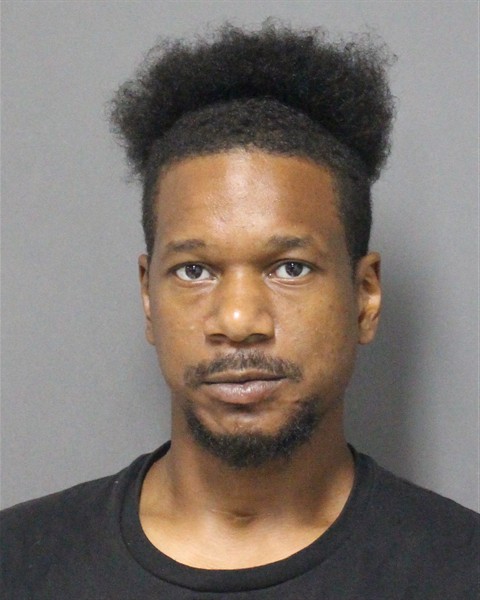 Booking photo of Migrague Wilson
