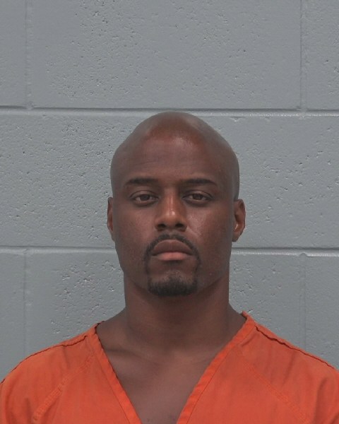 Booking photo of Alain Pidi