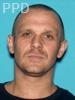 Booking photo of Michael Adams
