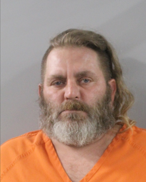 Booking photo of Aaron Detrick