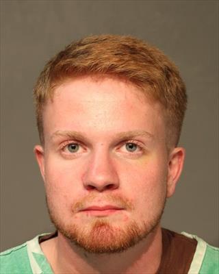 Booking photo of Aaron Michael Tomlinson