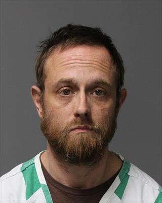 Booking photo of Samuel Grant Wood
