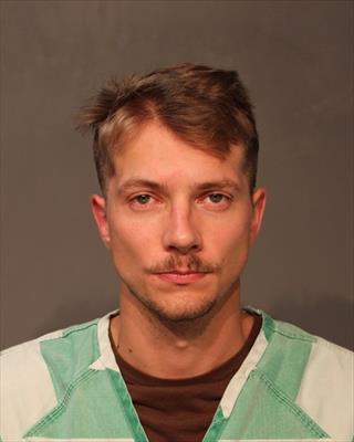Booking photo of Ashton Elijah Powell