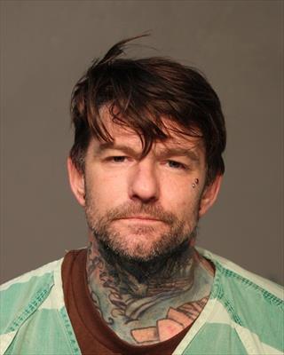 Booking photo of Travis Michael Gruber