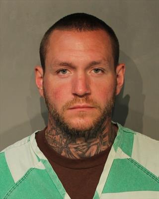 Booking photo of Travis Michael Heinz