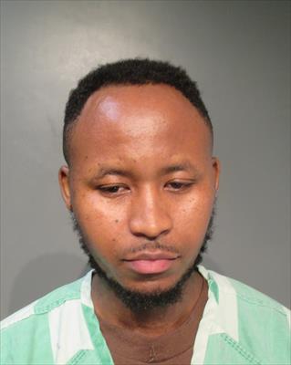 Booking photo of Isaac Muzima