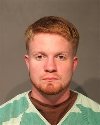 Booking photo of Aaron Michael Tomlinson