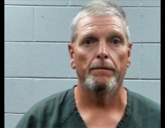 Booking photo of John Hughes