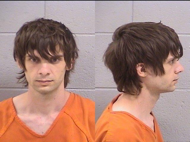 Booking photo of Alex Holland